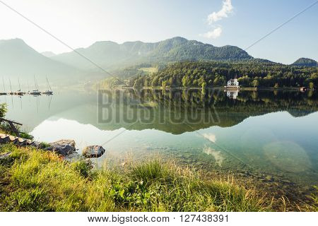 Fantastic views of the morning lake glowing by sunlight. Dramatic and picturesque scene. Location: resort Grundlsee, Liezen District of Styria, Austria, Alps. Europe. Beauty world. Instagram effect.