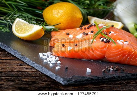 Salmon Filet Sliced On Three Parts With Lime And Herbs.