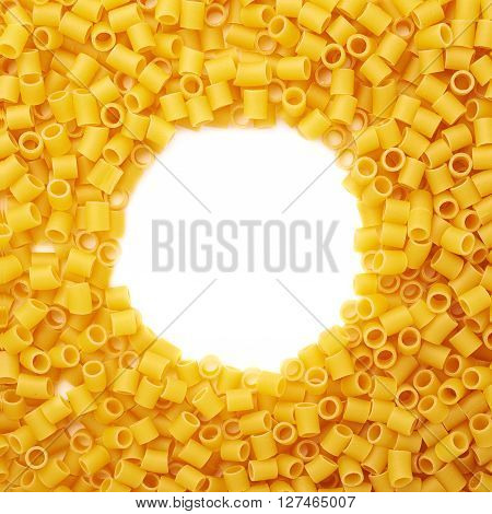Round frame made of dry ditalini yellow pasta over isolated white background
