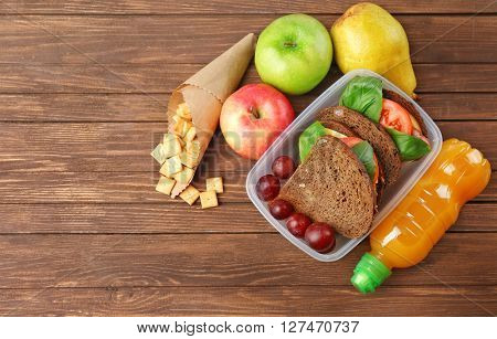 Kid school lunch on wooden background