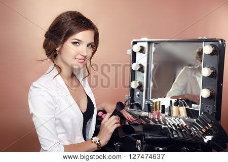 Beauty Makeup Artist Professional Stylist Holding Brushes In Dressing Drrom. Cosmetics. Attractive W