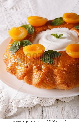 French Pastries: Savarin With Decorated Apricots And Mint Close-up. Vertical