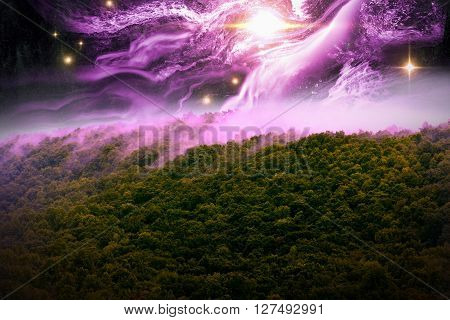 Misty mountains with night time star scape