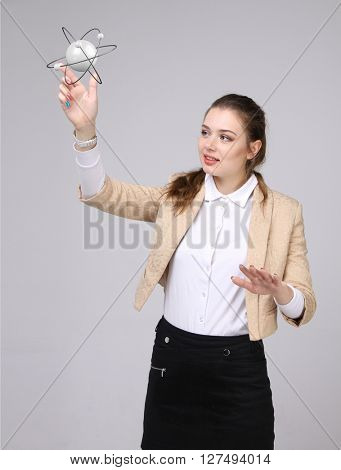 Woman scientist with atom model, research concept