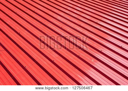Red metal sheet for industrial building and construction.