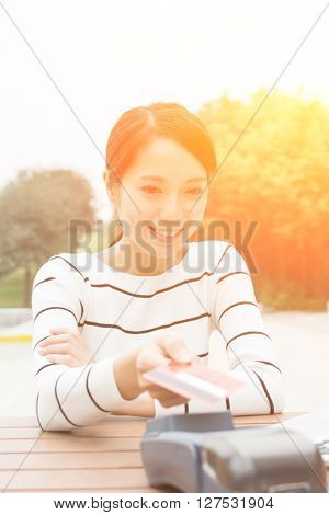 Woman using credit crad to pay