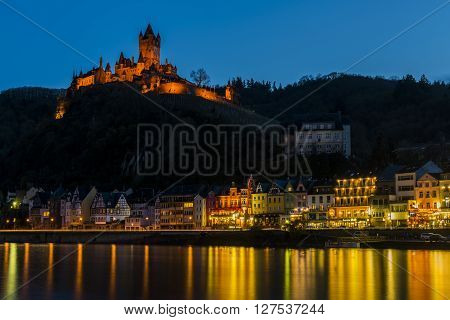 Cochem, Germany - March 28, 2016: Cochem at the Mossele in Germany at night with lights and a great castle Reichsburg.