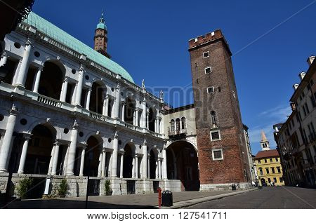 Renaisance Basilica Palladiana loggia and its old prison tower seen from Piazza delle Erbe square in the historic center of Vicenza