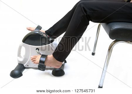 Woman exercising on exercise bike Upper / Lower body rehab hand cycle