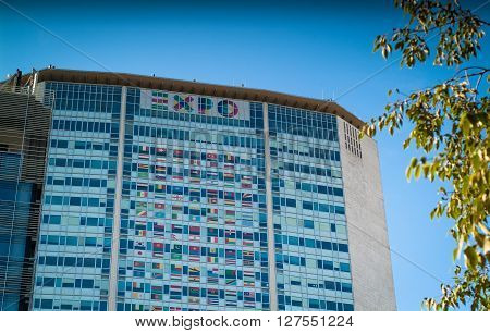Milan, Italy - September 5th 2015: photo of the Pirelli Tower in Milan decorated to promote the 2015 Expo event.