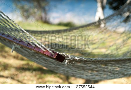 closeup of a white hammock photographed at Piani d'Erna (part of the Alps) near Lake Como in Italy