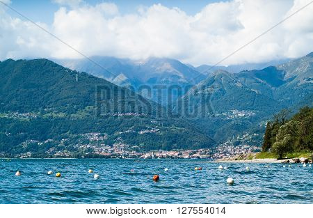 colorful buoys floating on Lake Como photographed from the area near Colico a town in north Italy