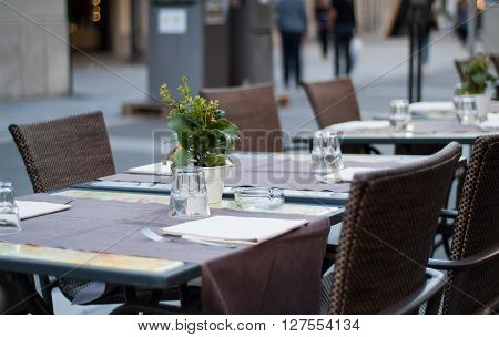 Lecco Italy - September 8th 2015: tables ready to welcome visitors at a restaurant in Lecco an Italian town near Lake Como.