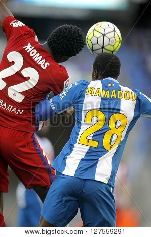 BARCELONA - APRIL, 9: Thomas Partey(L) of Atletico Madrid and Mamadou Sylla(R) of RCD Espanyol vie during a Spanish League match at the Power8 stadium on April 9, 2016 in Barcelona, Spain