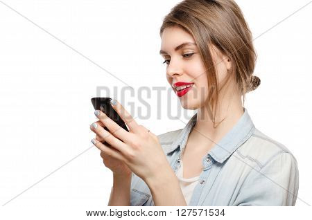 Beautiful Young Woman Chatting Sms Or Serfing The Internet By Mobile Phone, On A White Background