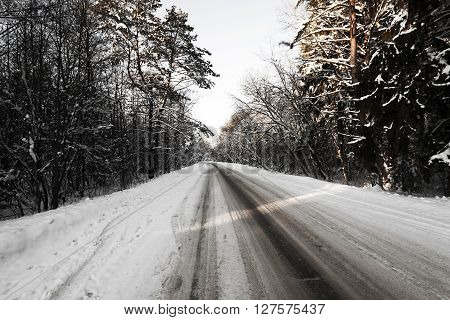 Photographed Road In The Winter. Winter, The Road Is Covered With Snow