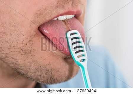 Man Cleaning Her Tongue
