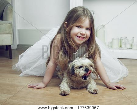 happy girl with her dog at home