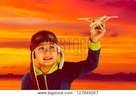 Asian Chinese Boy Playing With Wooden Airplane