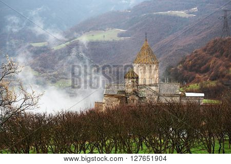Ancient monastery Tatev covered with clouds in the mountains of Armenia. Was founded in year 906. 