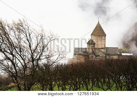 Ancient monastery Tatev covered with clouds in the mountains of Armenia. Was founded in year 906. 
