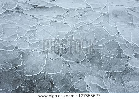 Many overlapping washed up and transparent ice floes