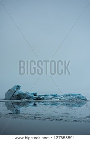 Beautiful light-blue iceberg in glacier lake Jökulsárlón in Iceland
