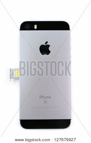 PARIS FRANCE - APR 21 2016: Instalation of the new SIM card in the new Apple iPhone SE combining the updated processor 4K rear camera touch id retina display