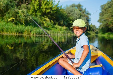 Summer vacation - Little boy fishing at the river