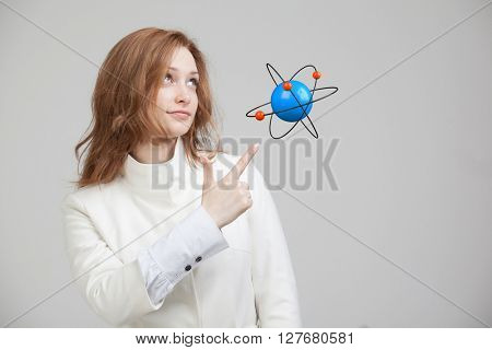 Woman scientist with atom model, research concept