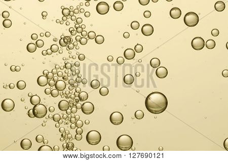 Beautiful golden champagne bubbles in a bottle of champagne