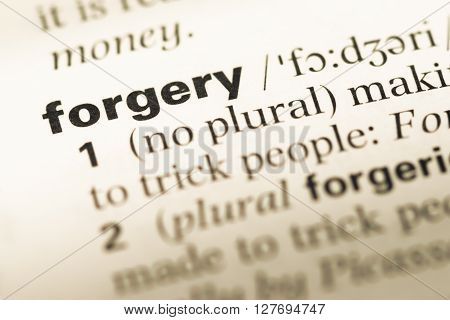 Close Up Of Old English Dictionary Page With Word Forgery.