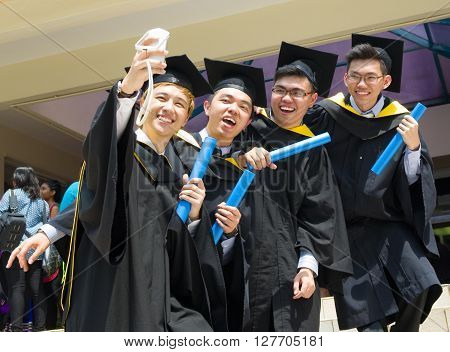 Setapak Kuala Lumpur Malaysia. Nov 07 2015:Graduates from Universiti Tunku Abdul Rahman (UTAR) share their joy with friends during convocation.UTAR is a leading public university in Malaysia.