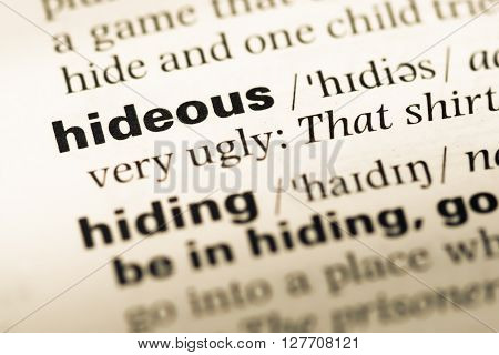 Close Up Of Old English Dictionary Page With Word Hideous.