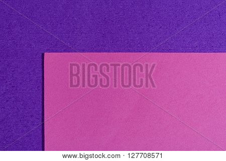 Eva foam ethylene vinyl acetate smooth pink surface on purple sponge plush background