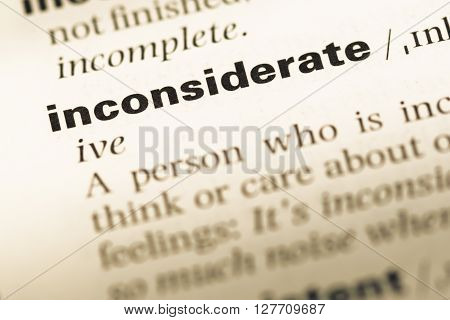 Close Up Of Old English Dictionary Page With Word Inconsiderate.