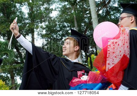 Setapak Kuala Lumpur Malaysia. Nov 07 2015:Graduates from Universiti Tunku Abdul Rahman (UTAR) share their joy with friendstaking selfie during convocation.UTAR is a leading public university in Malaysia.