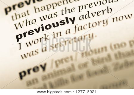 Close Up Of Old English Dictionary Page With Word Previously.