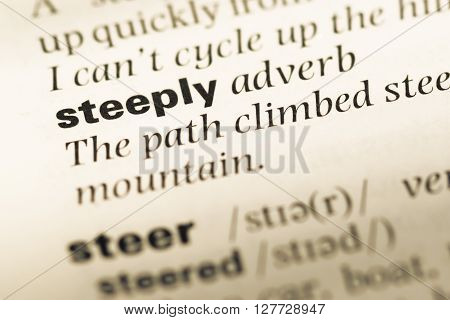 Close Up Of Old English Dictionary Page With Word Steeply.