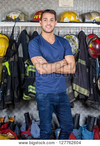 Smiling Firefighter Standing At Fire Station