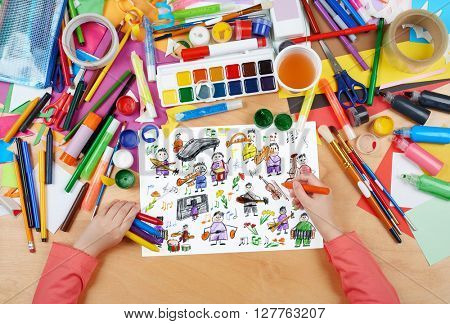 cartoon people musician collection child drawing, top view hands with pencil painting picture on paper, artwork workplace