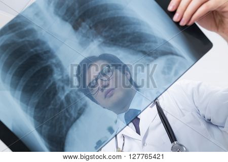Doctor's Face Behind X-ray