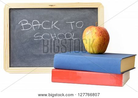 back to school written on blackboard with book and apple
