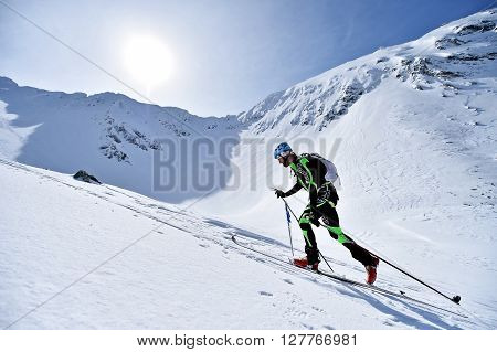 FAGARAS ROMANIA - MARCH 5: Ski mountaineer competes during the Ski Mountaineering National Competition in Fagaras Mountains on March 5 2016 in Romania.