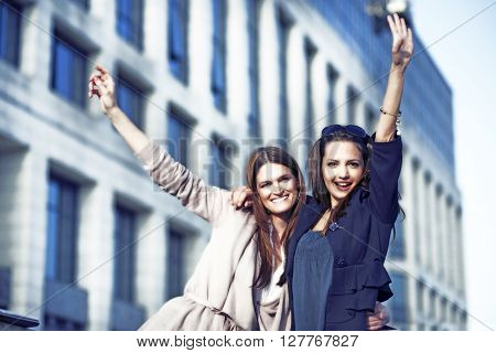 Young womens working together outside and having fun