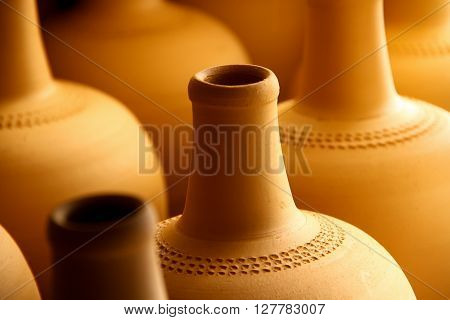 hand made pitchers waiting  for before oven