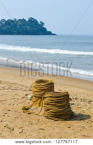 Rope on sand beach goa india near ocean