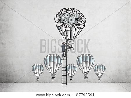 Businessman climbing ladder on concrete wall with airballoons and gears sketch