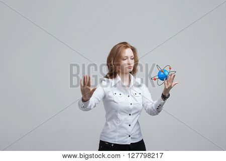 Woman scientist with atom model, research concept