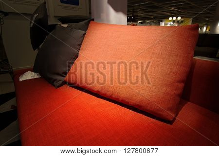 Light spot on a pilow red sofa relaxing concept